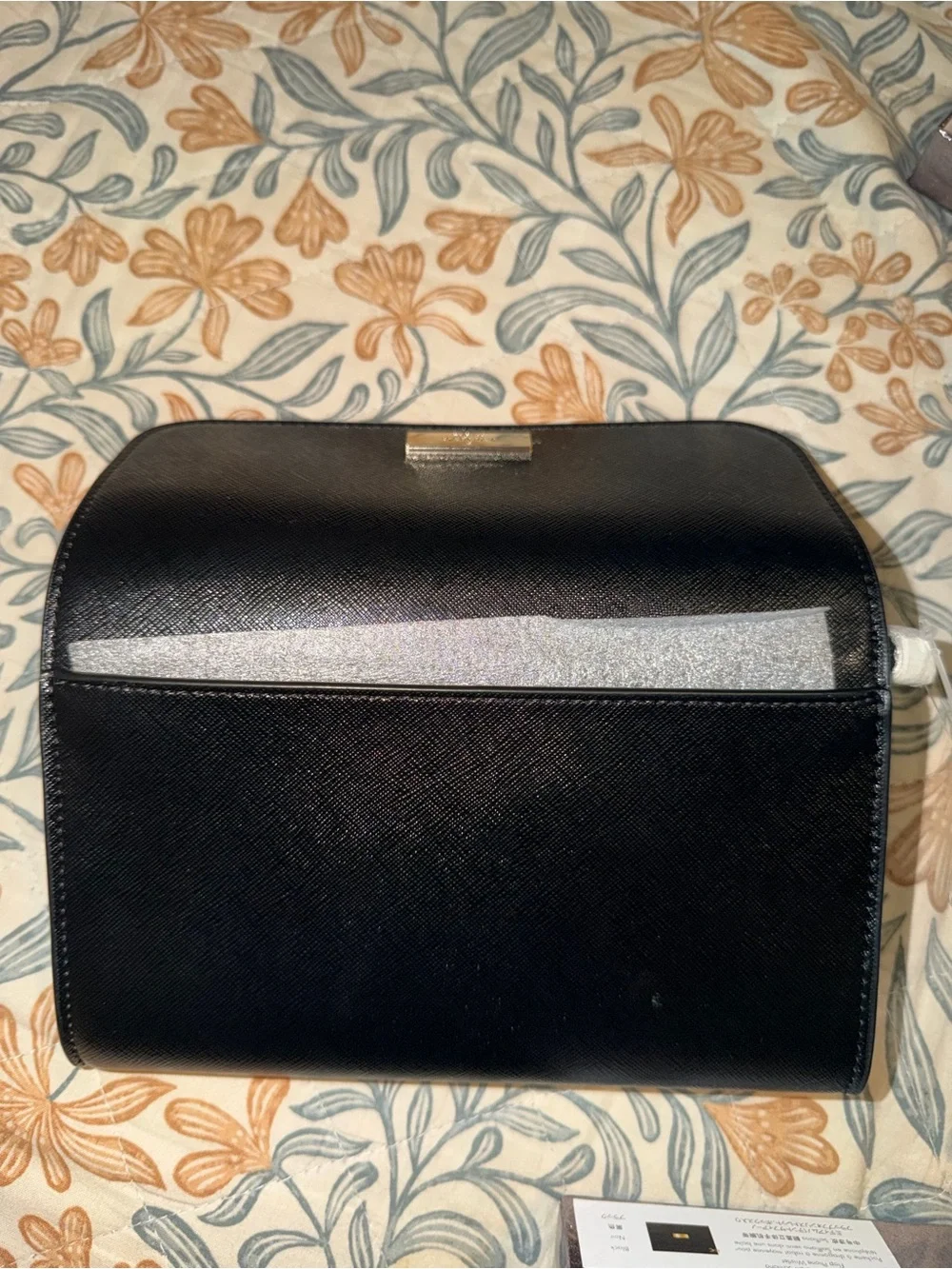 kate spade black saffiano leather flap wallet with gold plaque